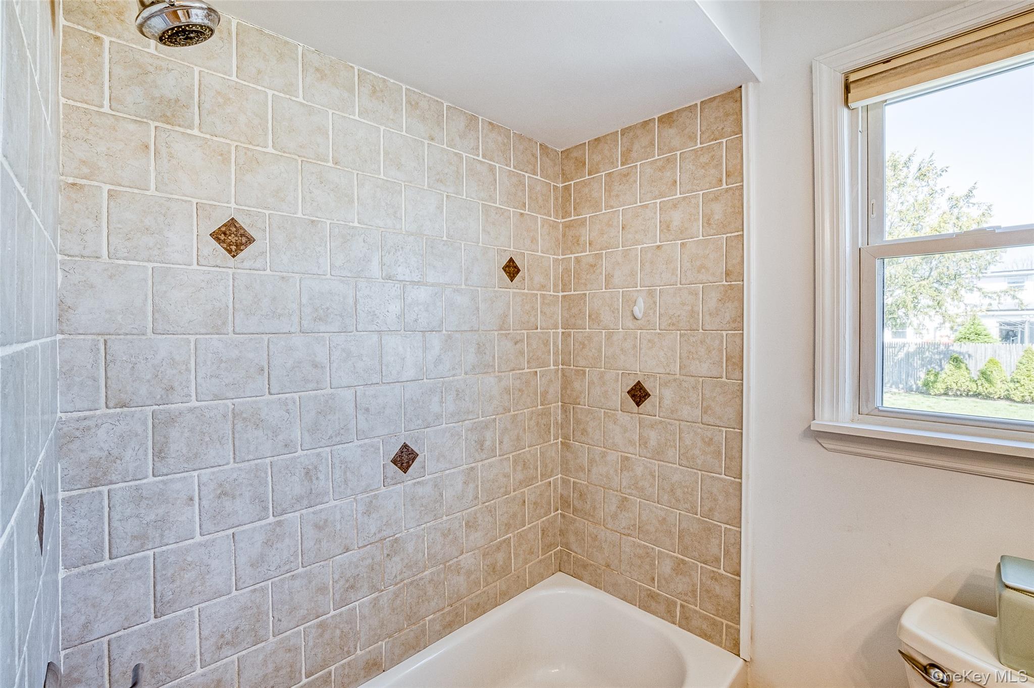 210 11th Street West Babylon, NY 11704 - Photo 13 of 36 a bathroom with a shower