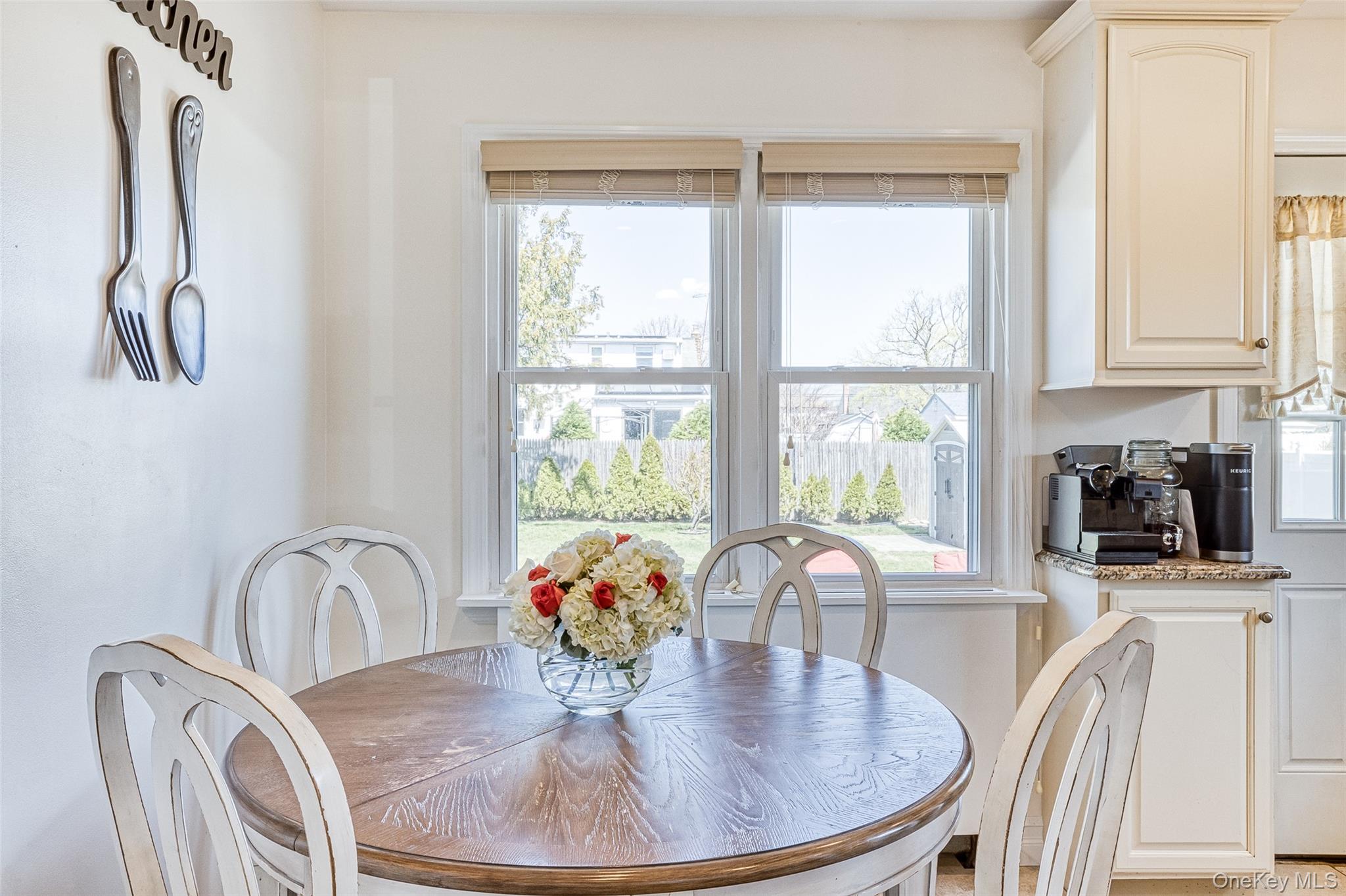 210 11th Street West Babylon, NY 11704 - Photo 17 of 36 a view of a dining room with furniture window and outside view