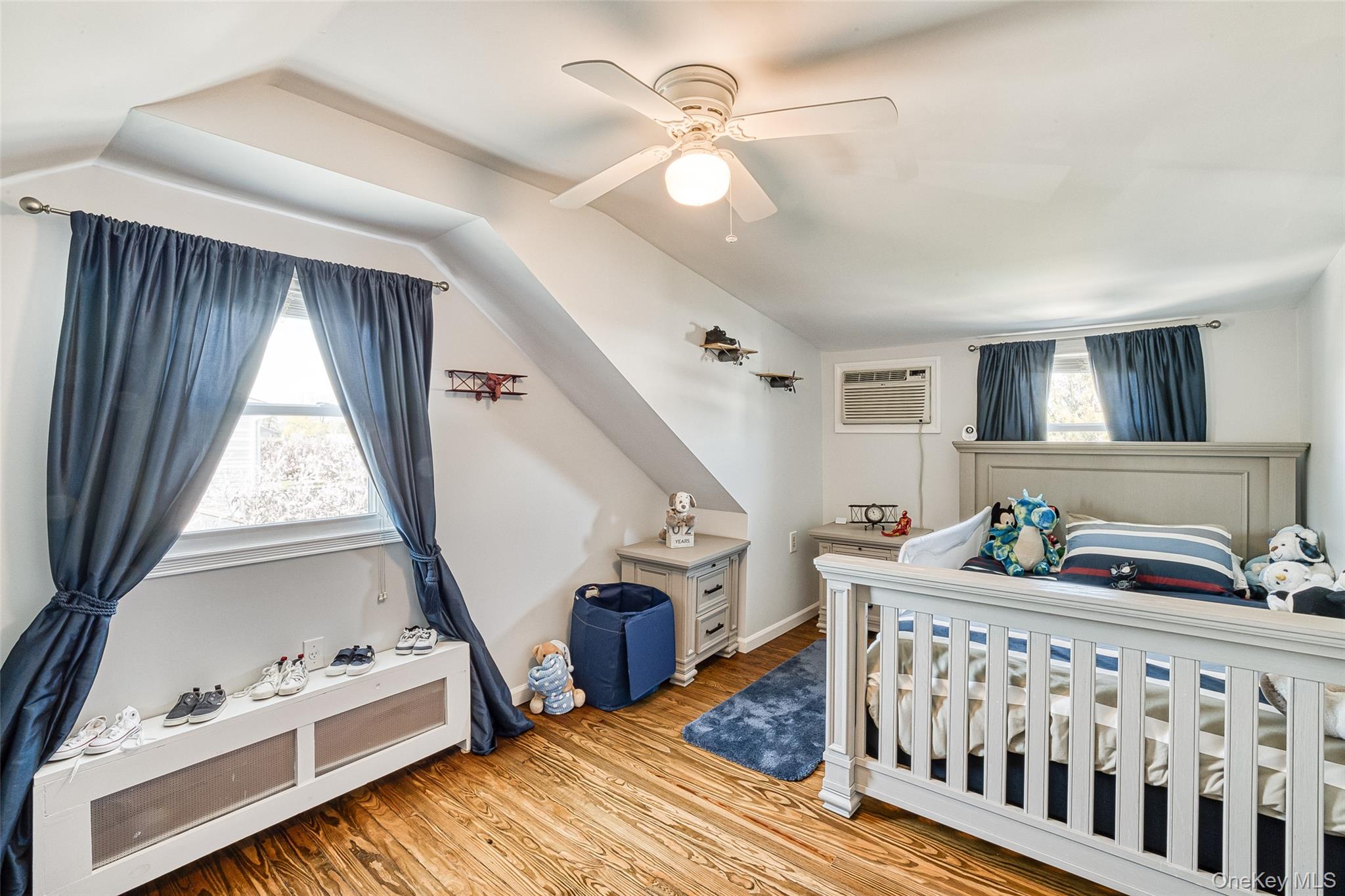 210 11th Street West Babylon, NY 11704 - Photo 28 of 36 a bedroom with furniture and a window