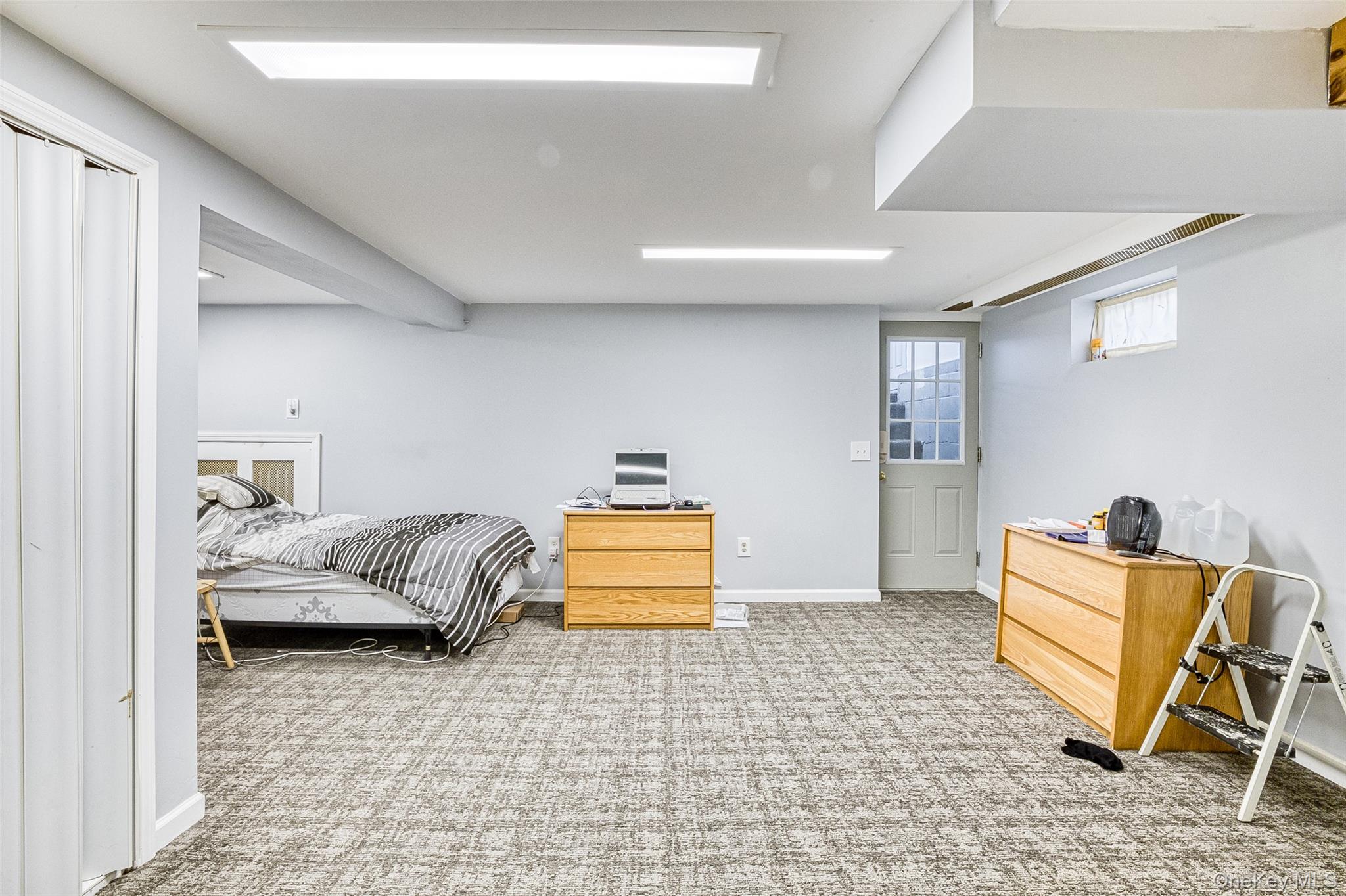 210 11th Street West Babylon, NY 11704 - Photo 29 of 36 a bedroom with furniture and a couch