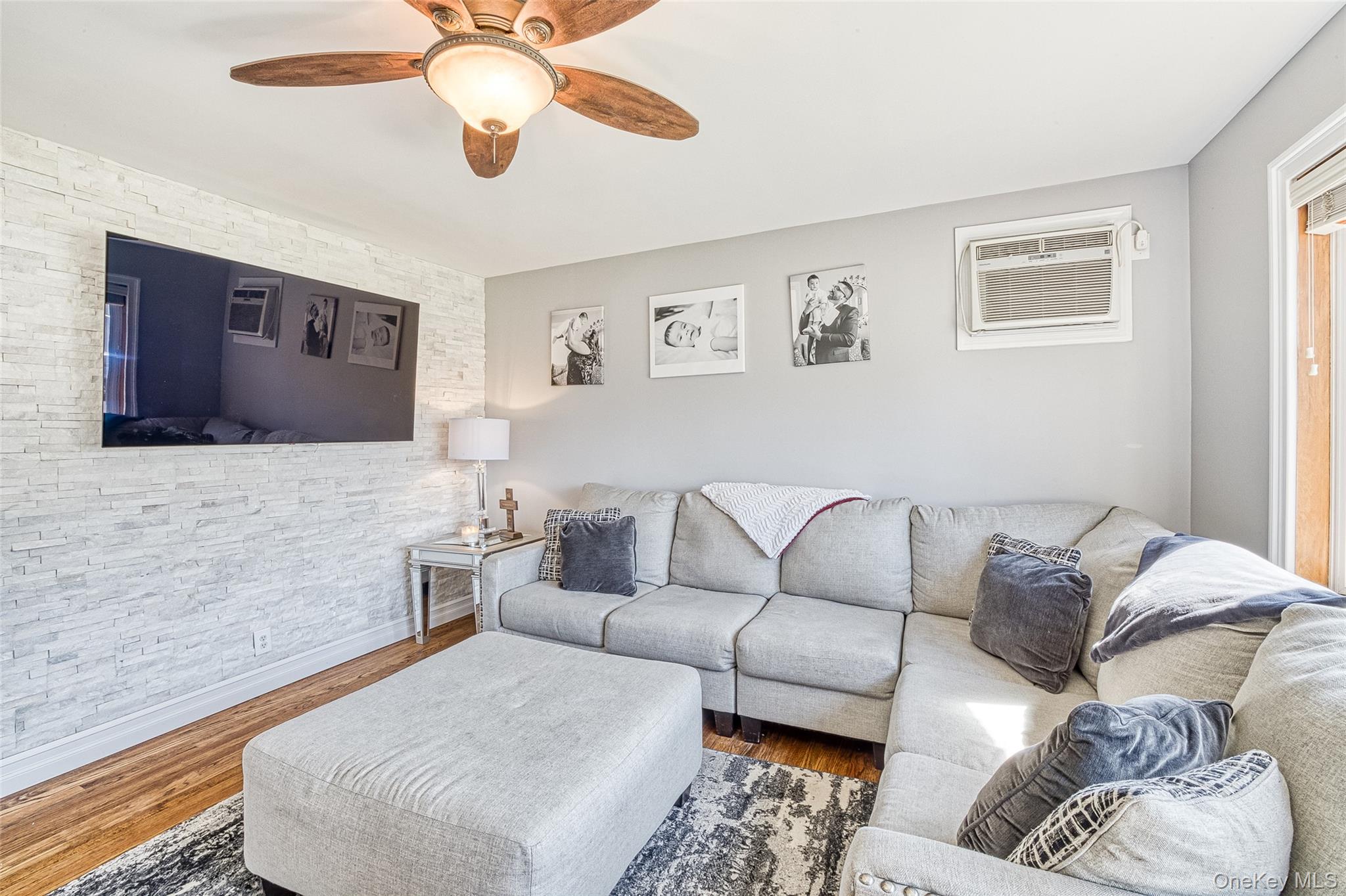 210 11th Street West Babylon, NY 11704 - Photo 6 of 36 a living room with furniture and a flat screen tv