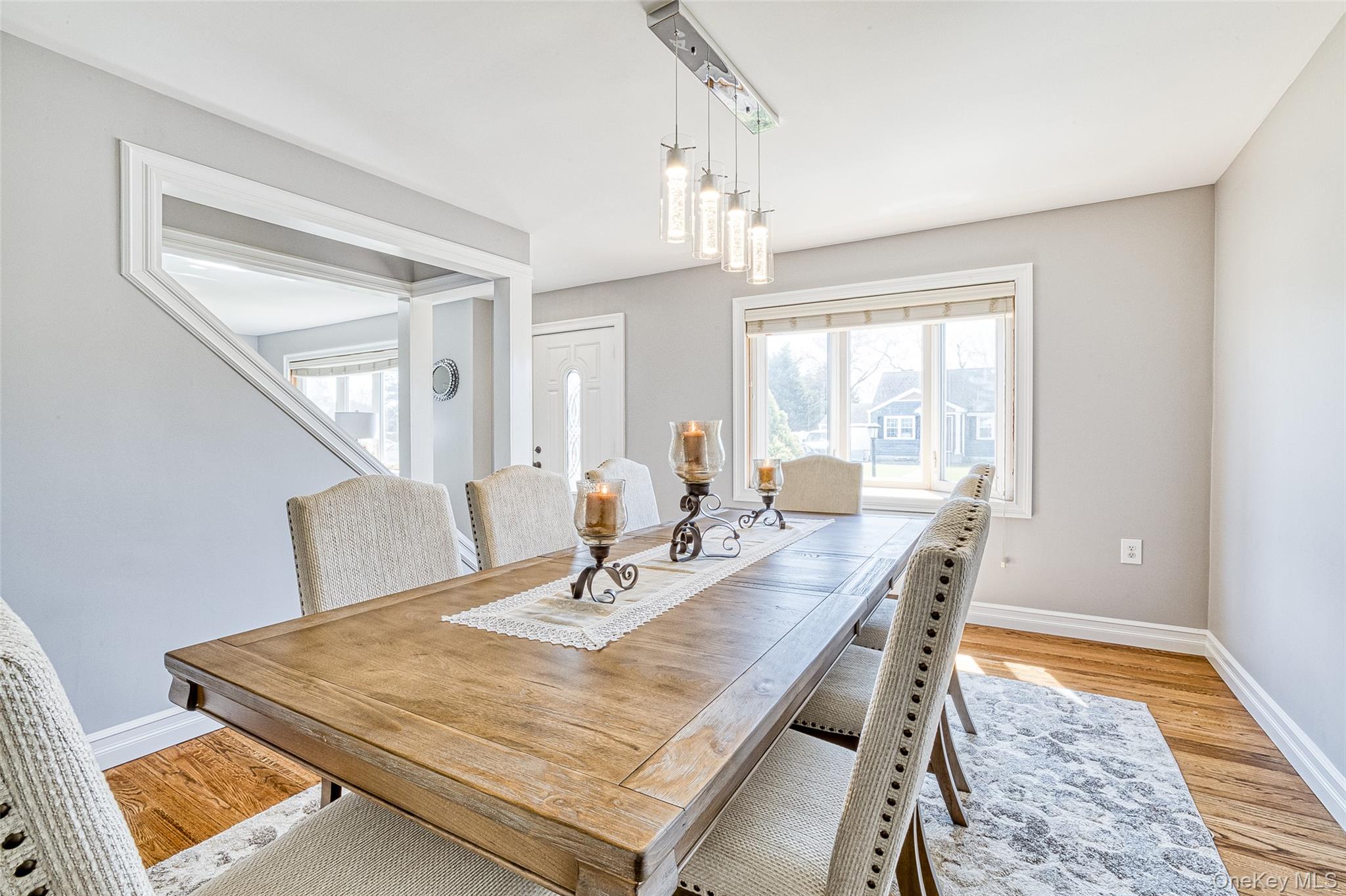 210 11th Street West Babylon, NY 11704 - Photo 10 of 36 a view of a dining room with furniture and wooden floor