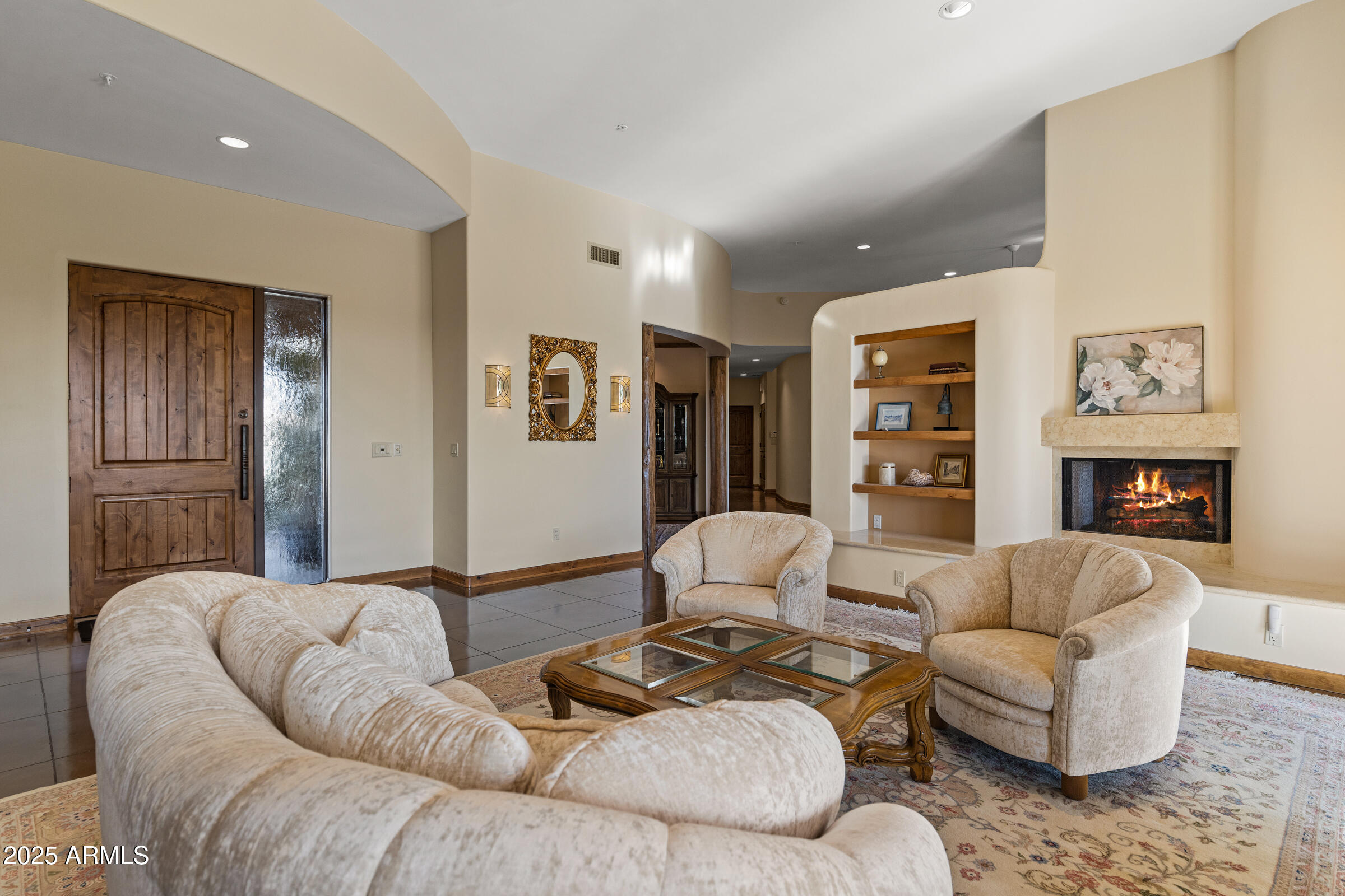 36663 Wild Flower Road Carefree, AZ 85377 - Photo 17 of 79 a living room with furniture and a fireplace