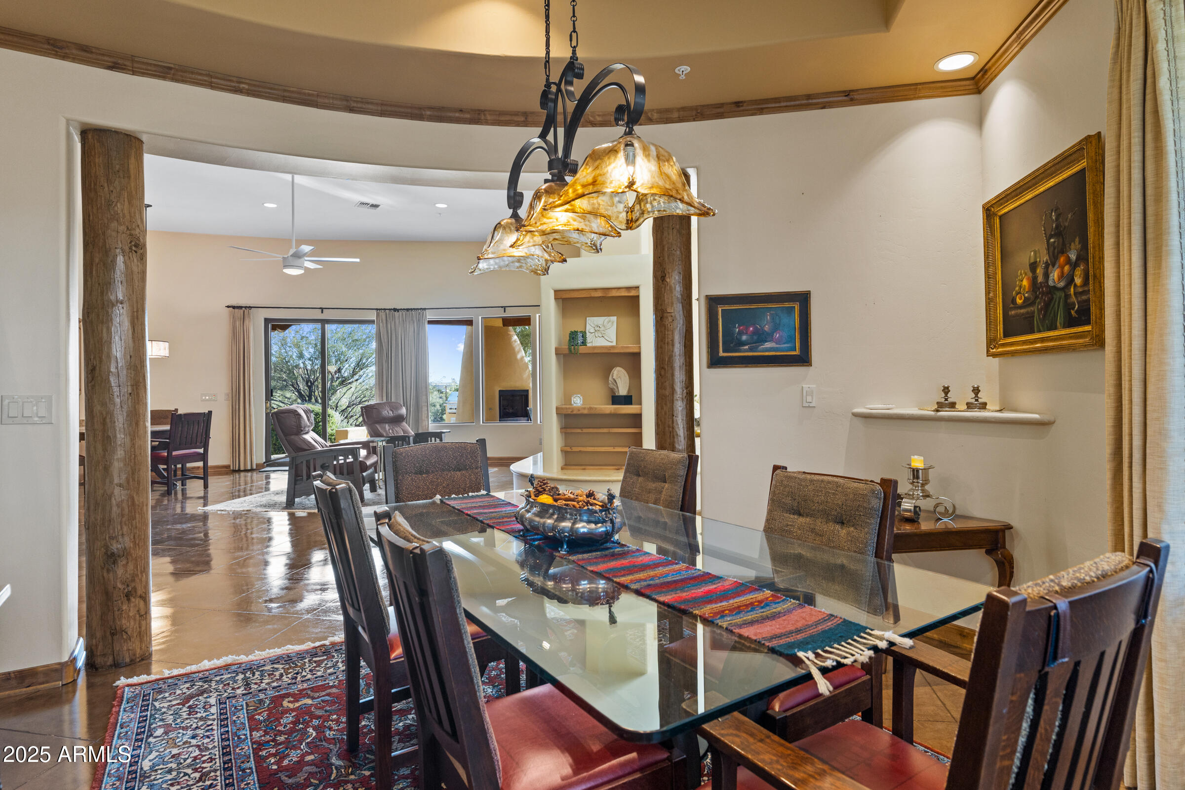 36663 Wild Flower Road Carefree, AZ 85377 - Photo 21 of 79 a view of a dining room with furniture a chandelier and wooden floor