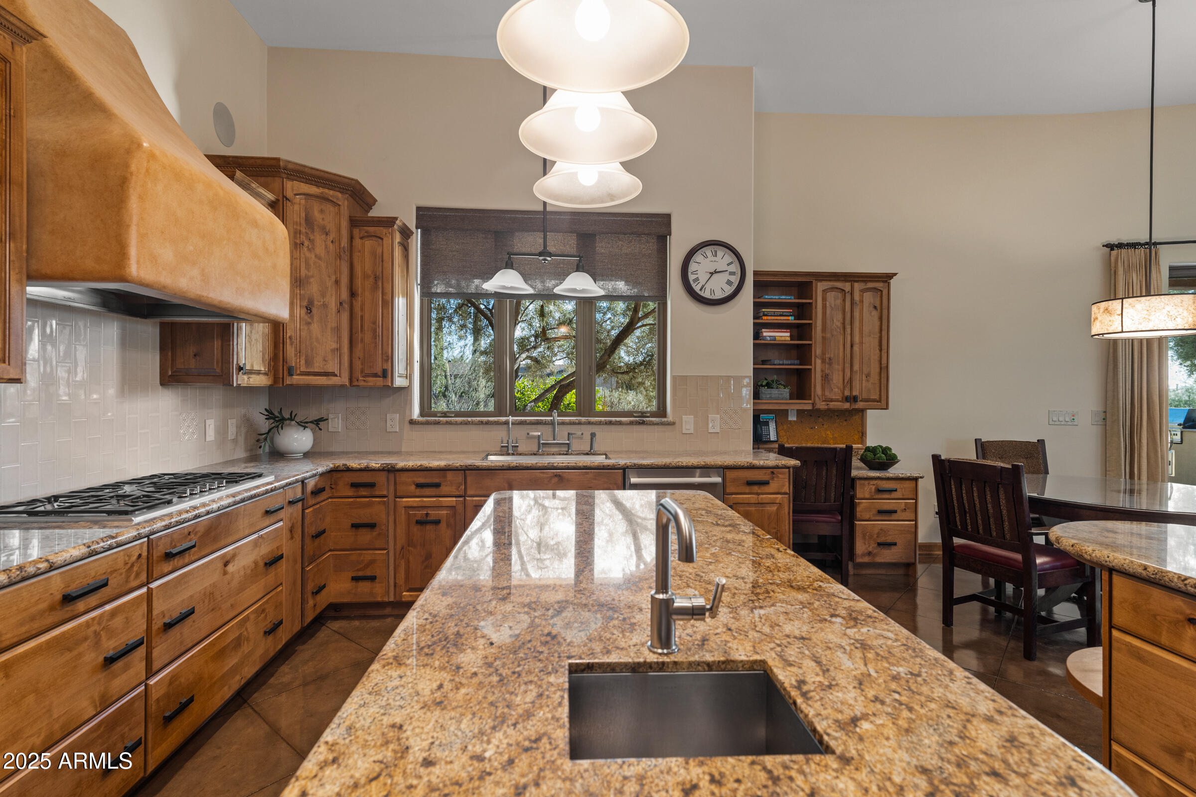 36663 Wild Flower Road Carefree, AZ 85377 - Photo 31 of 79 a kitchen with stainless steel appliances granite countertop a stove and a sink