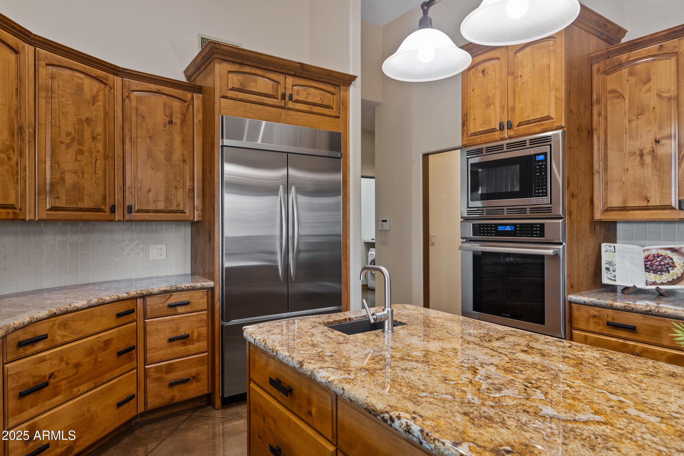 36663 Wild Flower Road Carefree, AZ 85377 - Photo 33 of 79 a kitchen with stainless steel appliances granite countertop a refrigerator and a stove top oven