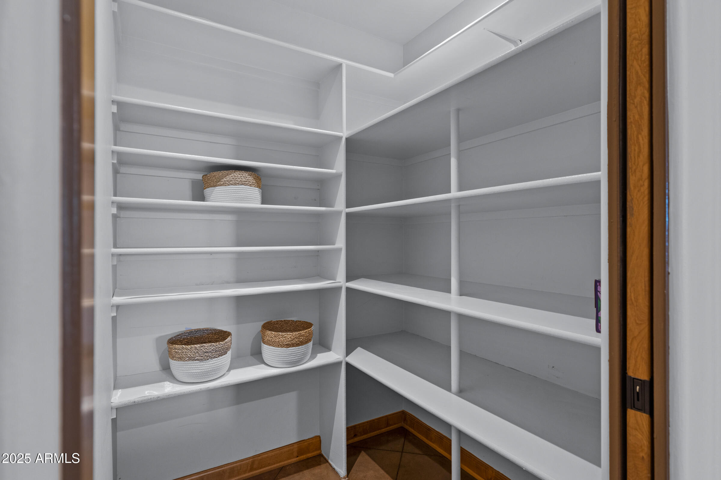 36663 Wild Flower Road Carefree, AZ 85377 - Photo 34 of 79 a view of walk in closet with empty racks