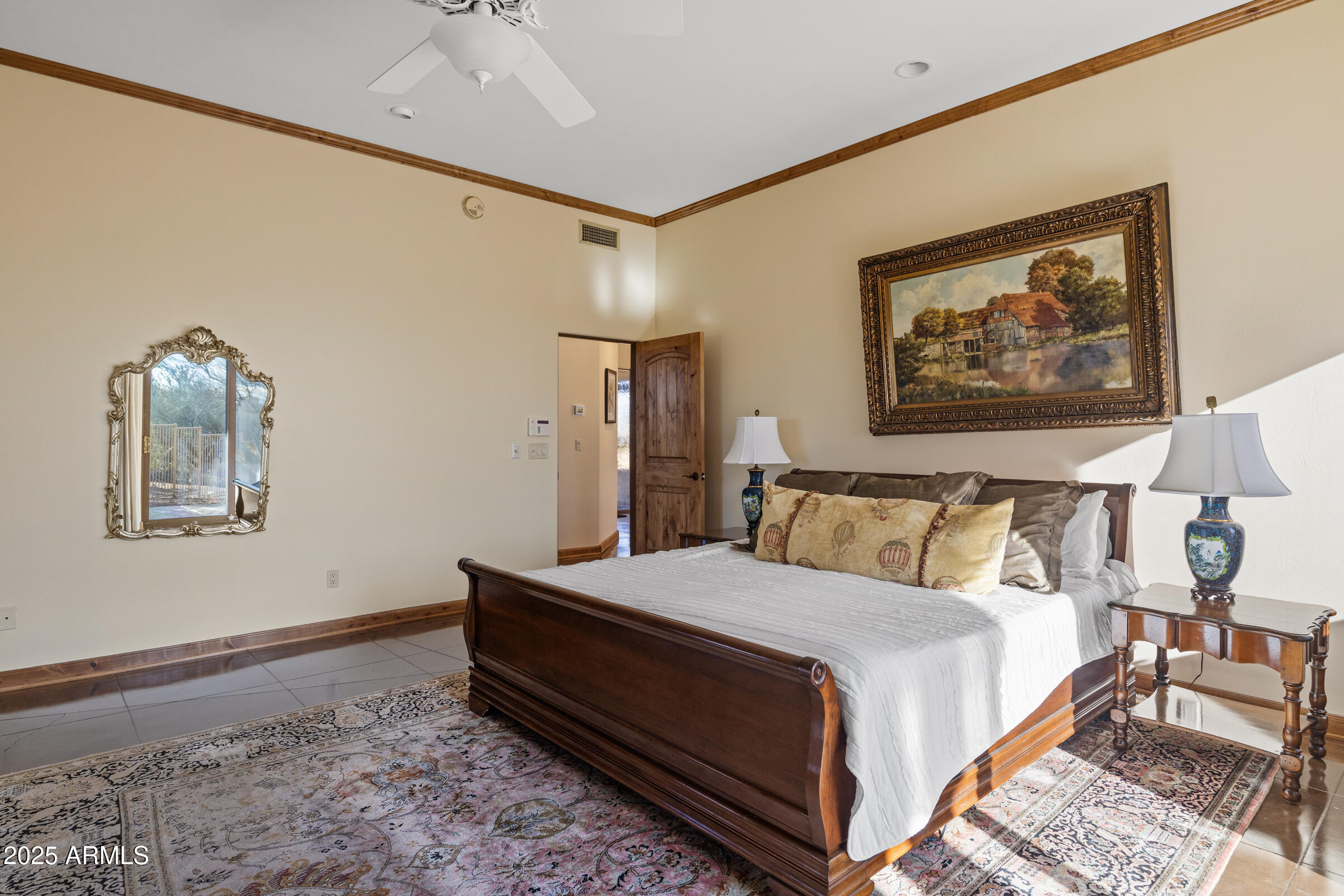 36663 Wild Flower Road Carefree, AZ 85377 - Photo 46 of 79 a bed room with a bed and a painting