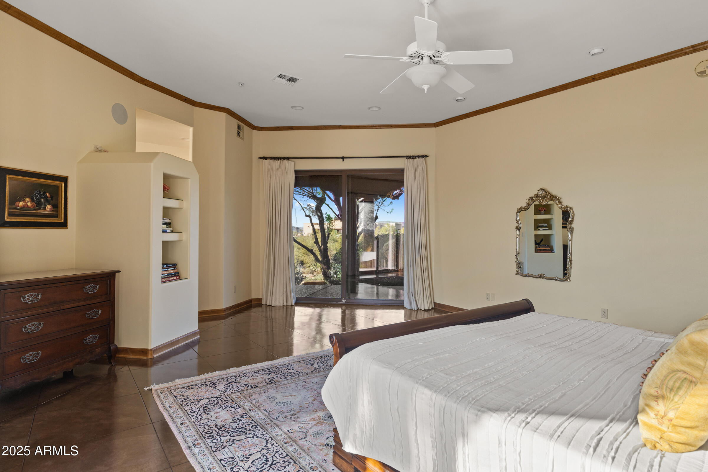 36663 Wild Flower Road Carefree, AZ 85377 - Photo 48 of 79 a bedroom with a large bed and a dresser