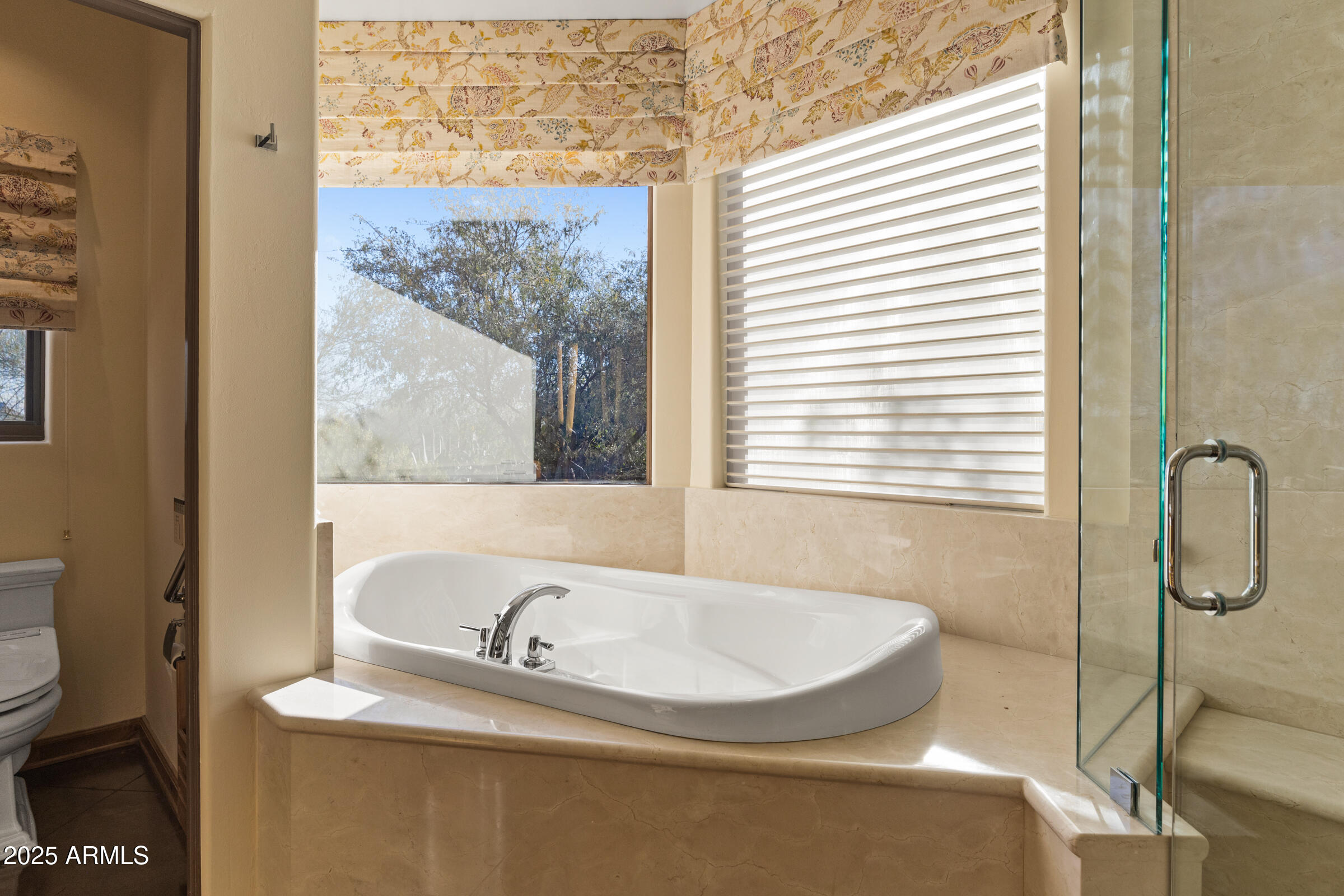 36663 Wild Flower Road Carefree, AZ 85377 - Photo 50 of 79 a bathroom with a tub and a window
