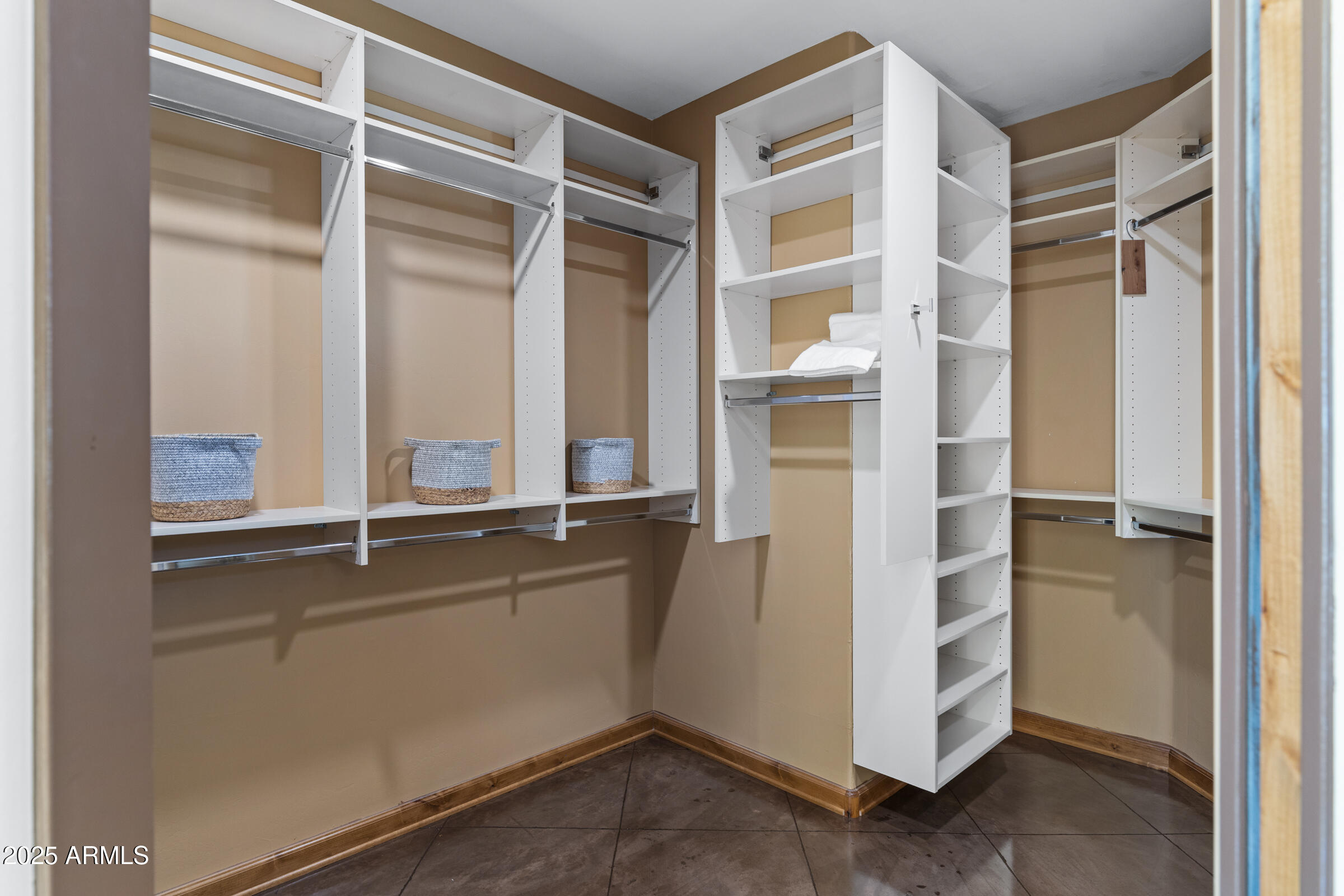 36663 Wild Flower Road Carefree, AZ 85377 - Photo 53 of 79 a view of walk in closet with empty racks