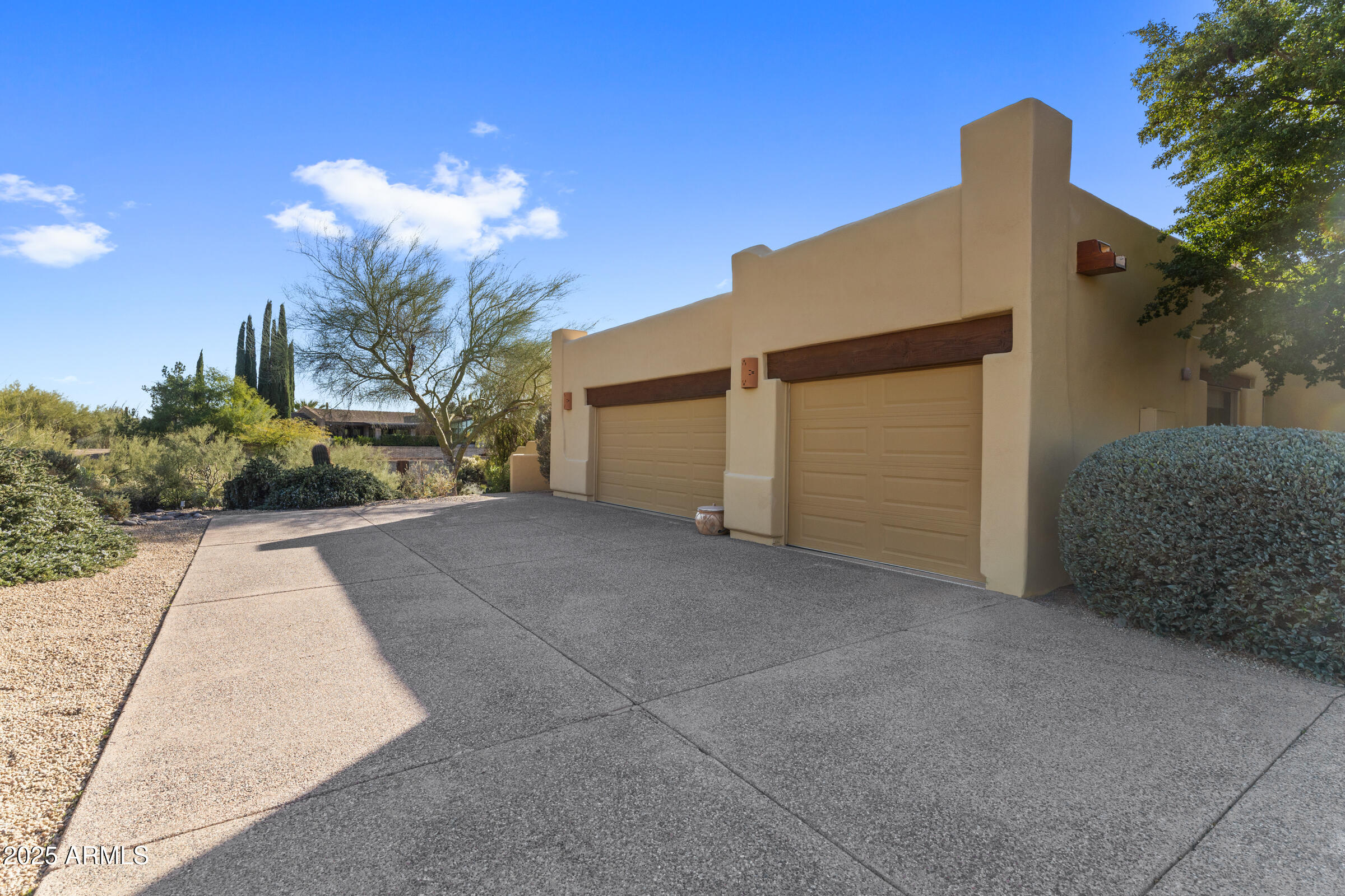 36663 Wild Flower Road Carefree, AZ 85377 - Photo 9 of 79 a view of a house with a yard and garage
