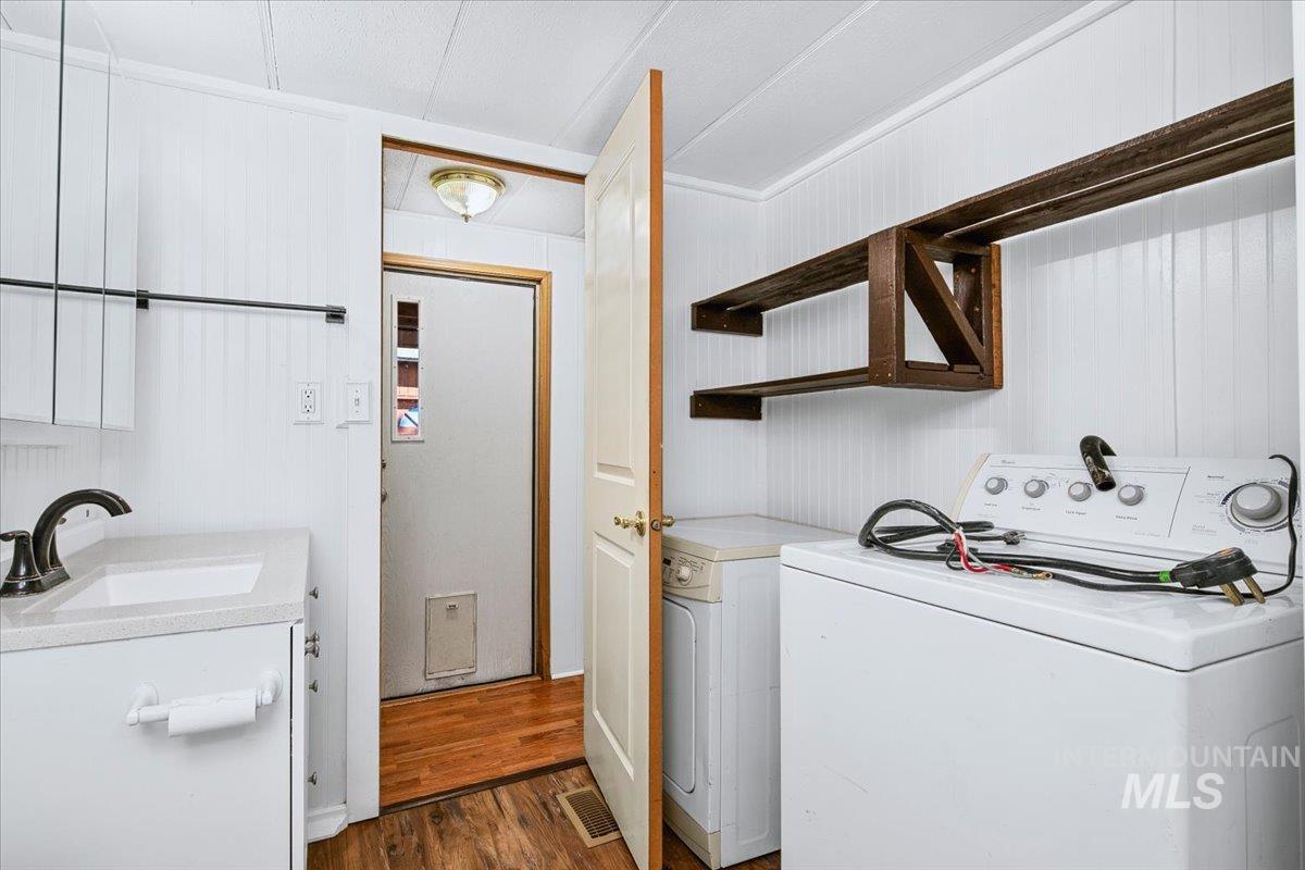 7701 West Ustick Road, Unit 14 Boise, ID 83704 - Photo 19 of 22 Laundry area featuring dark wood finished floors
