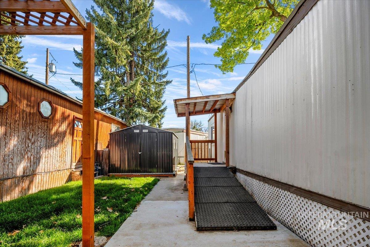 7701 West Ustick Road, Unit 14 Boise, ID 83704 - Photo 6 of 22 Fenced backyard with a shed