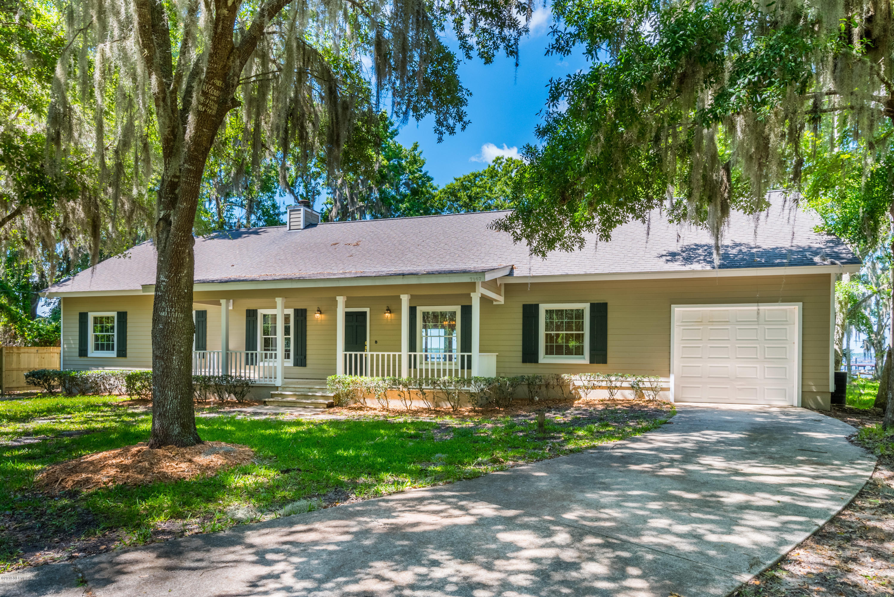 7867 Rusty Anchor Road St. Augustine, FL 32092 - Photo 3 of 36 a front view of a house with garden