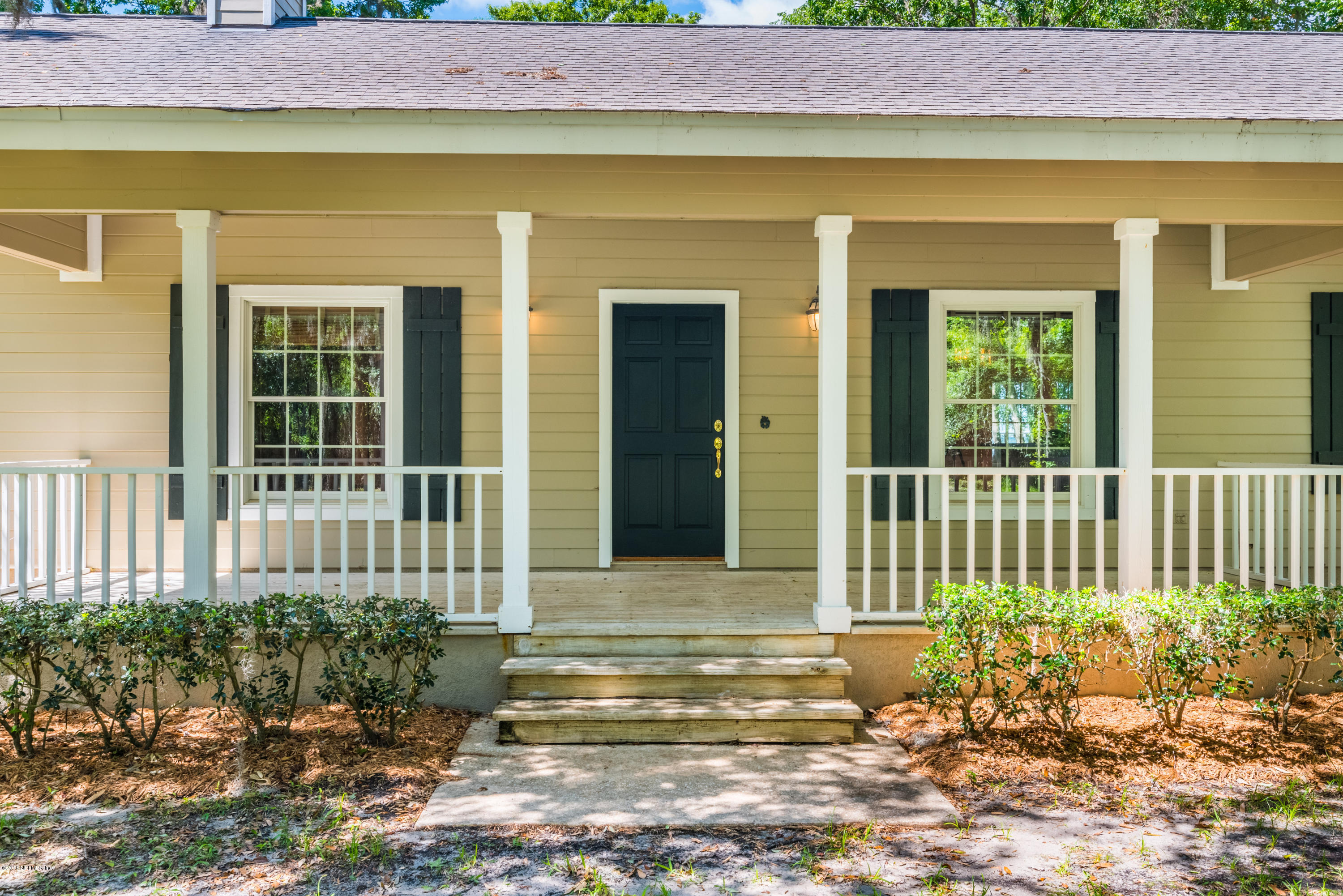 7867 Rusty Anchor Road St. Augustine, FL 32092 - Photo 36 of 36 a view of a house with a small yard and plants