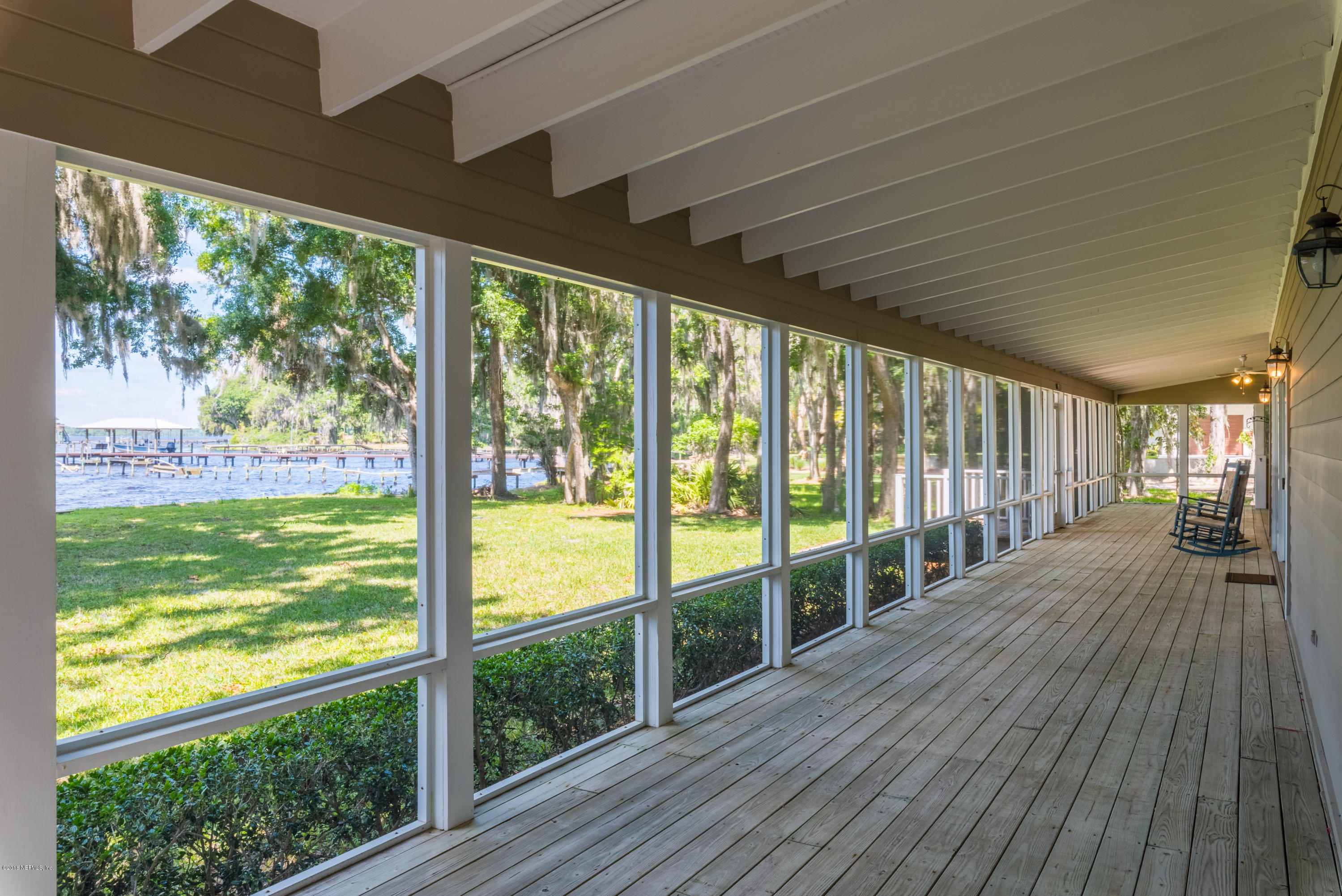 7867 Rusty Anchor Road St. Augustine, FL 32092 - Photo 10 of 36 a view of a room with wooden floor and windows