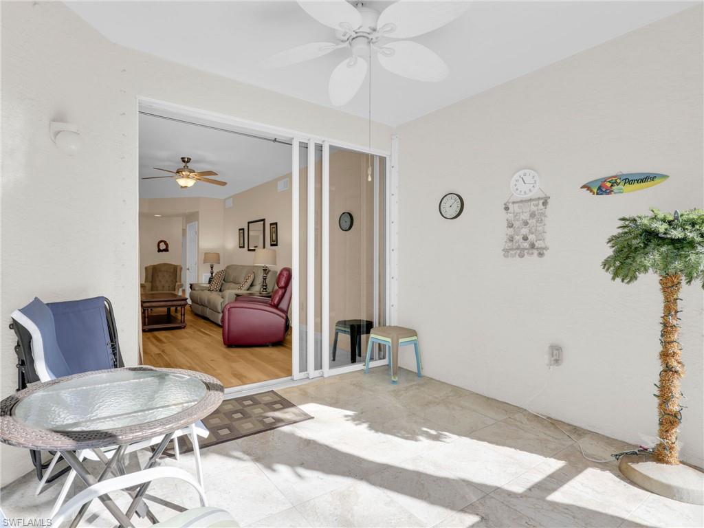 1435 Tiffany Lane, Unit 302 Naples, FL 34105 - Photo 18 of 36 a bedroom with furniture and a potted plant