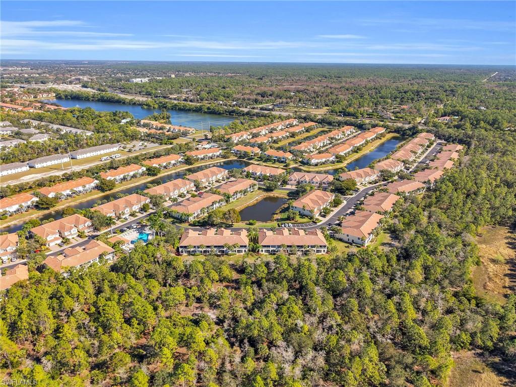 1435 Tiffany Lane, Unit 302 Naples, FL 34105 - Photo 34 of 36 an aerial view of residential building and lake