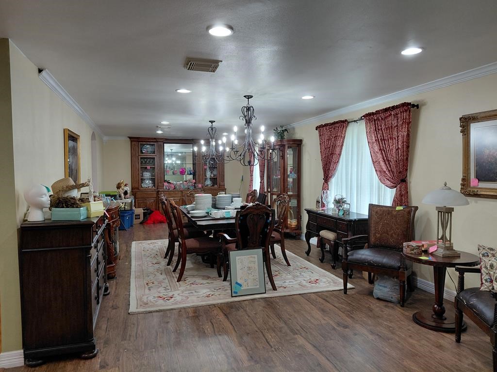 1231 County Road 201A Angleton, TX 77515 - Photo 21 of 26 a view of a dining room with furniture window and wooden floor