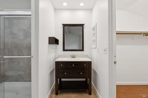 a bathroom with a sink and a mirror