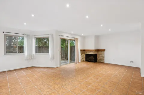 a view of an empty room with windows