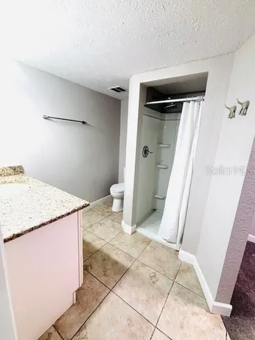 a view of storage and utility room with a sink