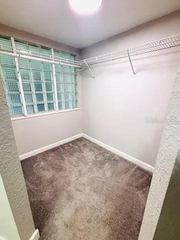 a view of empty room with windows