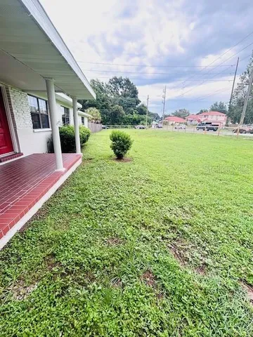 a view of a garden with an apartment