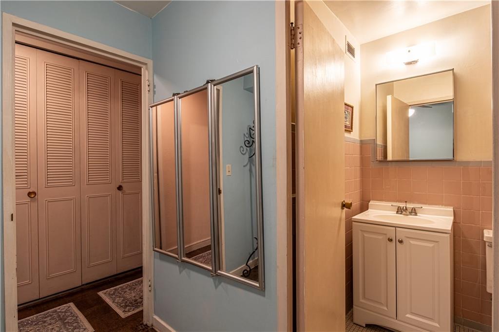 112 Washington Place, Unit 2F Pittsburgh, PA 15219 - Photo 19 of 30 a bathroom with a sink a toilet and shower