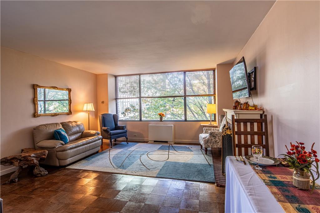 112 Washington Place, Unit 2F Pittsburgh, PA 15219 - Photo 7 of 30 a living room with furniture and a window