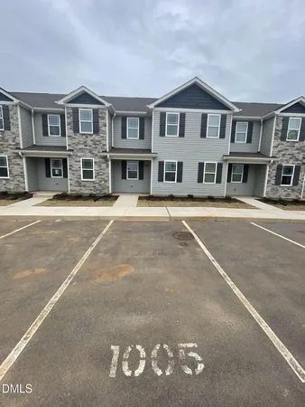 a front view of a building with a street