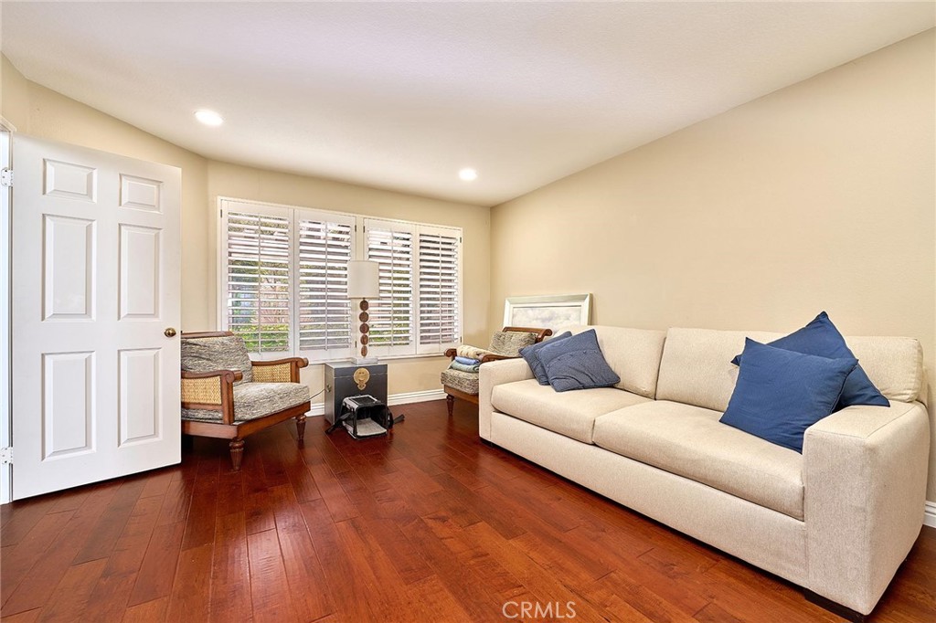 9 La Quinta Irvine, CA 92612 - Photo 11 of 39 a living room with furniture and wooden floor