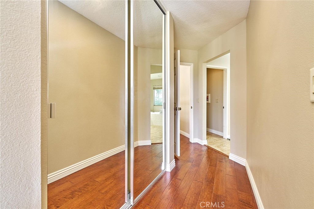 9 La Quinta Irvine, CA 92612 - Photo 20 of 39 a view of a hallway with wooden floor