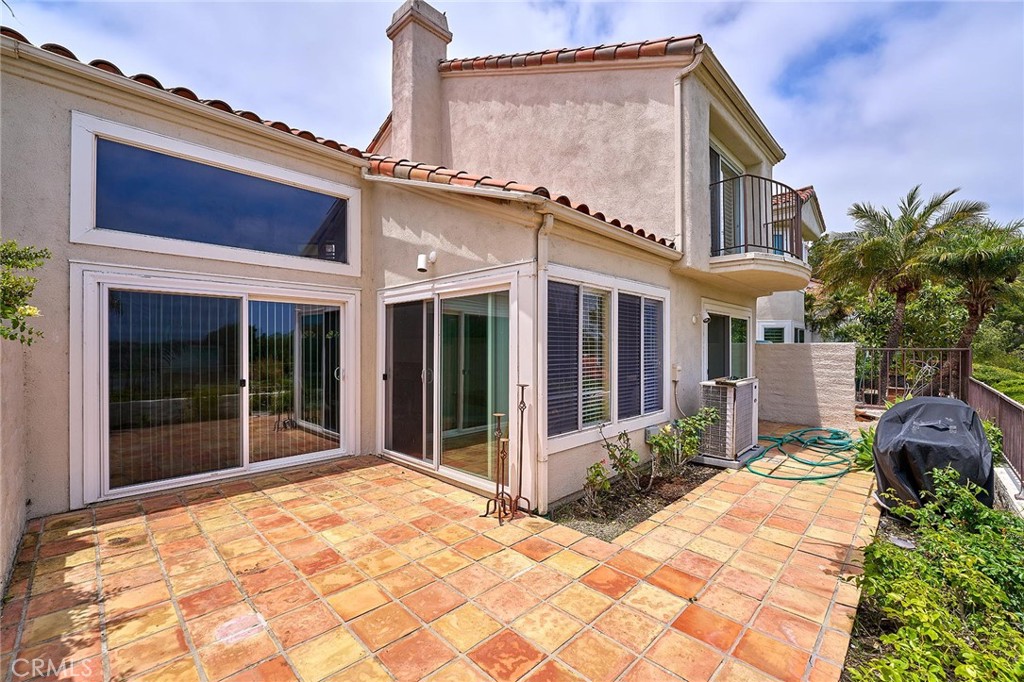 9 La Quinta Irvine, CA 92612 - Photo 31 of 39 a view of a house with a large window and potted plants