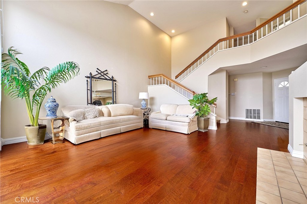 9 La Quinta Irvine, CA 92612 - Photo 7 of 39 a living room with furniture and a potted plant