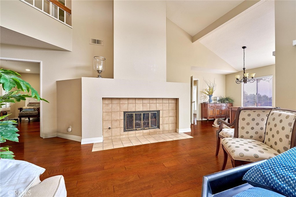9 La Quinta Irvine, CA 92612 - Photo 8 of 39 a living room with furniture and a fireplace