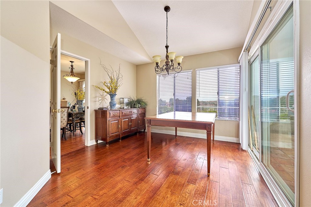 9 La Quinta Irvine, CA 92612 - Photo 9 of 39 a living room with furniture and a wooden floor