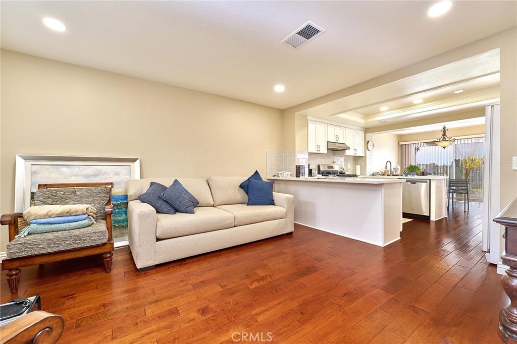9 La Quinta Irvine, CA 92612 - Photo 10 of 39 a living room with kitchen island granite countertop furniture and a large window