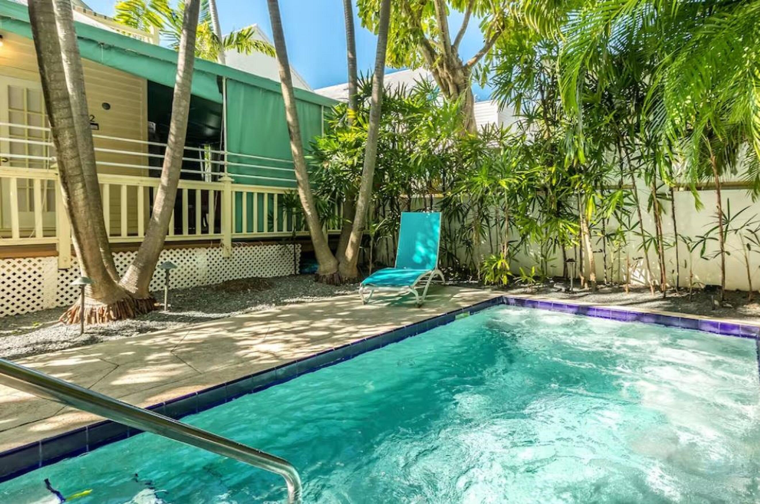 905 White Street, Unit 2 Key West, FL 33040 - Photo 1 of 1 a view of a backyard with a sitting area