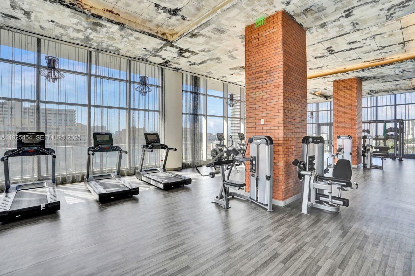 4010 South Ocean Drive, Unit R1108 Hollywood, FL 33019 - Photo 11 of 30 a view of a room with gym equipment