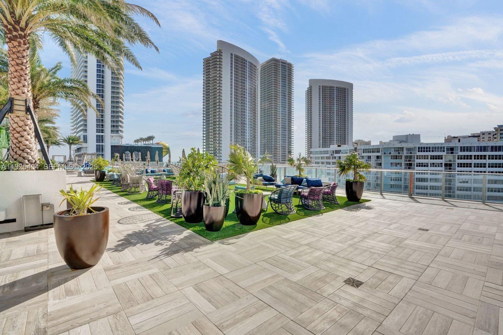 4010 South Ocean Drive, Unit R1108 Hollywood, FL 33019 - Photo 16 of 30 a view of a terrace with chairs