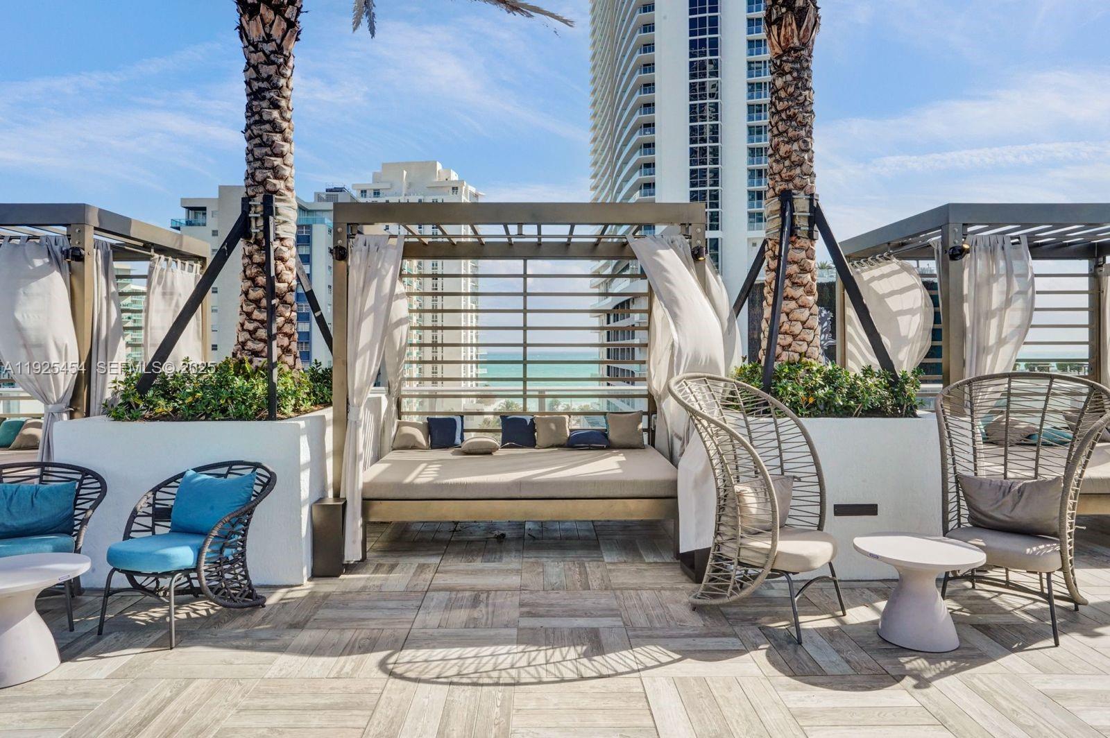 4010 South Ocean Drive, Unit R1108 Hollywood, FL 33019 - Photo 20 of 30 a building outdoor space with patio furniture
