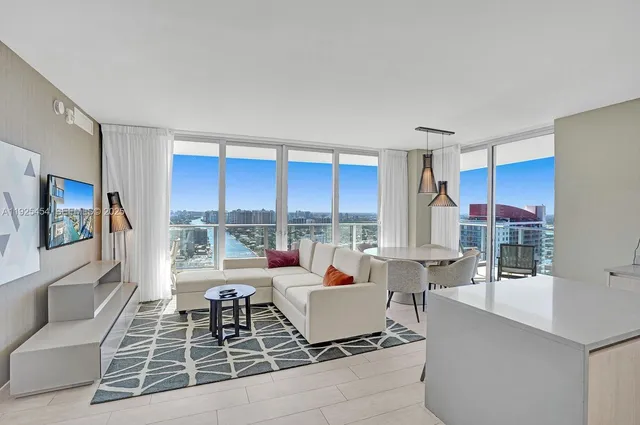 a living room with furniture and a flat screen tv