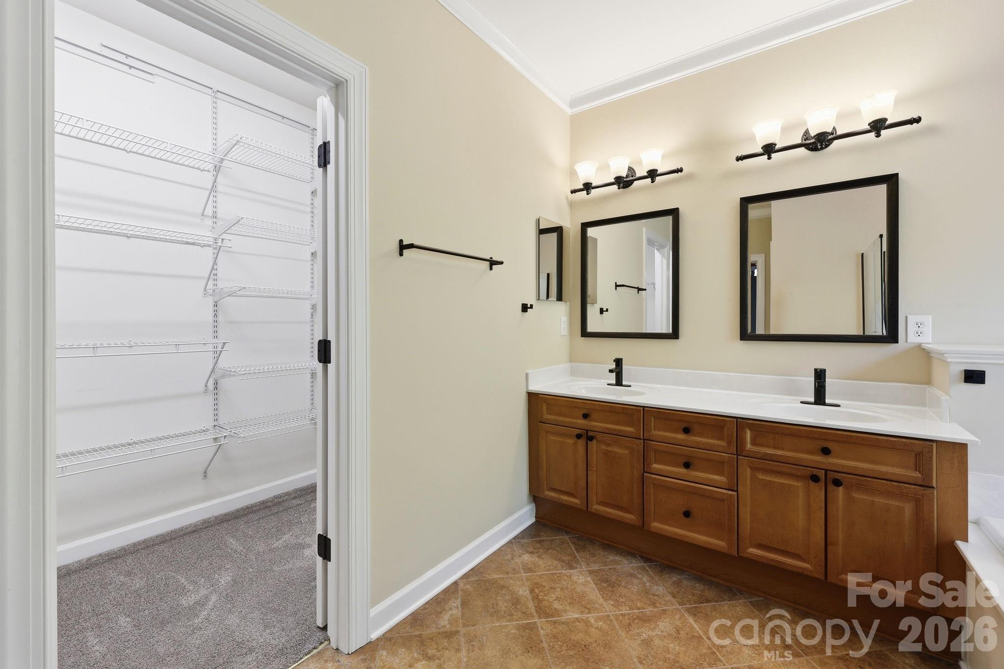 3308 Grandeur Road Charlotte, NC 28269 - Photo 21 of 45 a bathroom with a double vanity sink mirror and