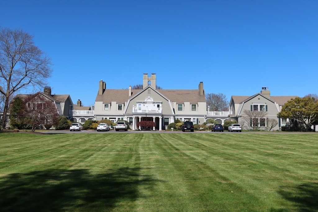 74 Branch Street, Unit 15 Scituate, MA 02066 - Photo 25 of 26 a view of a big house with a big yard and large trees