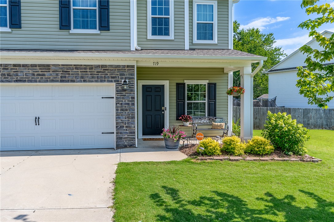 719 Camberwell Road Simpsonville, SC 29680 - Photo 32 of 47 A welcoming front porch and paved driveway frame the classic exterior of this two-story home.