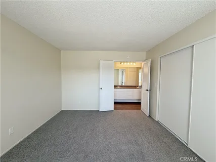 an empty room with a empty space and windows