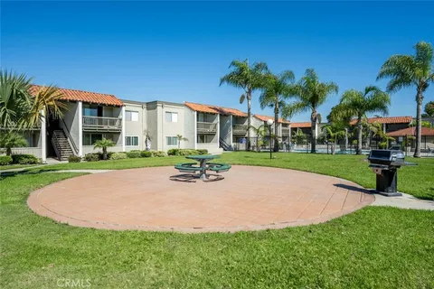 a view of a house with a swimming pool and a yard