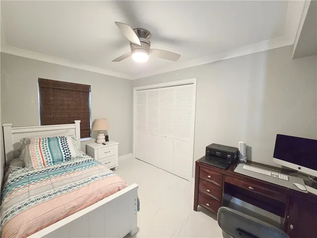 a bedroom with furniture and wooden floor